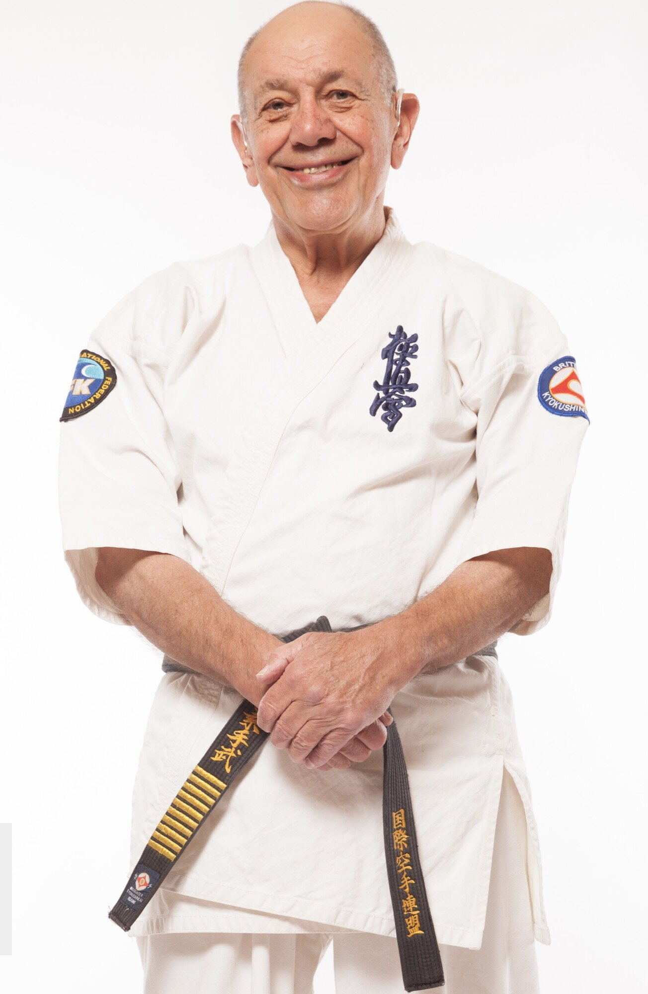 Hanshi Steve Arneil smiling in his gi, wearing his 9th Dan black belt in Kyokushin Karate
